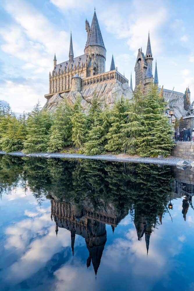 Hogwarts Castle reflected in lake at The Wizarding World of Harry Potter at Universal Studios Japan in Osaka