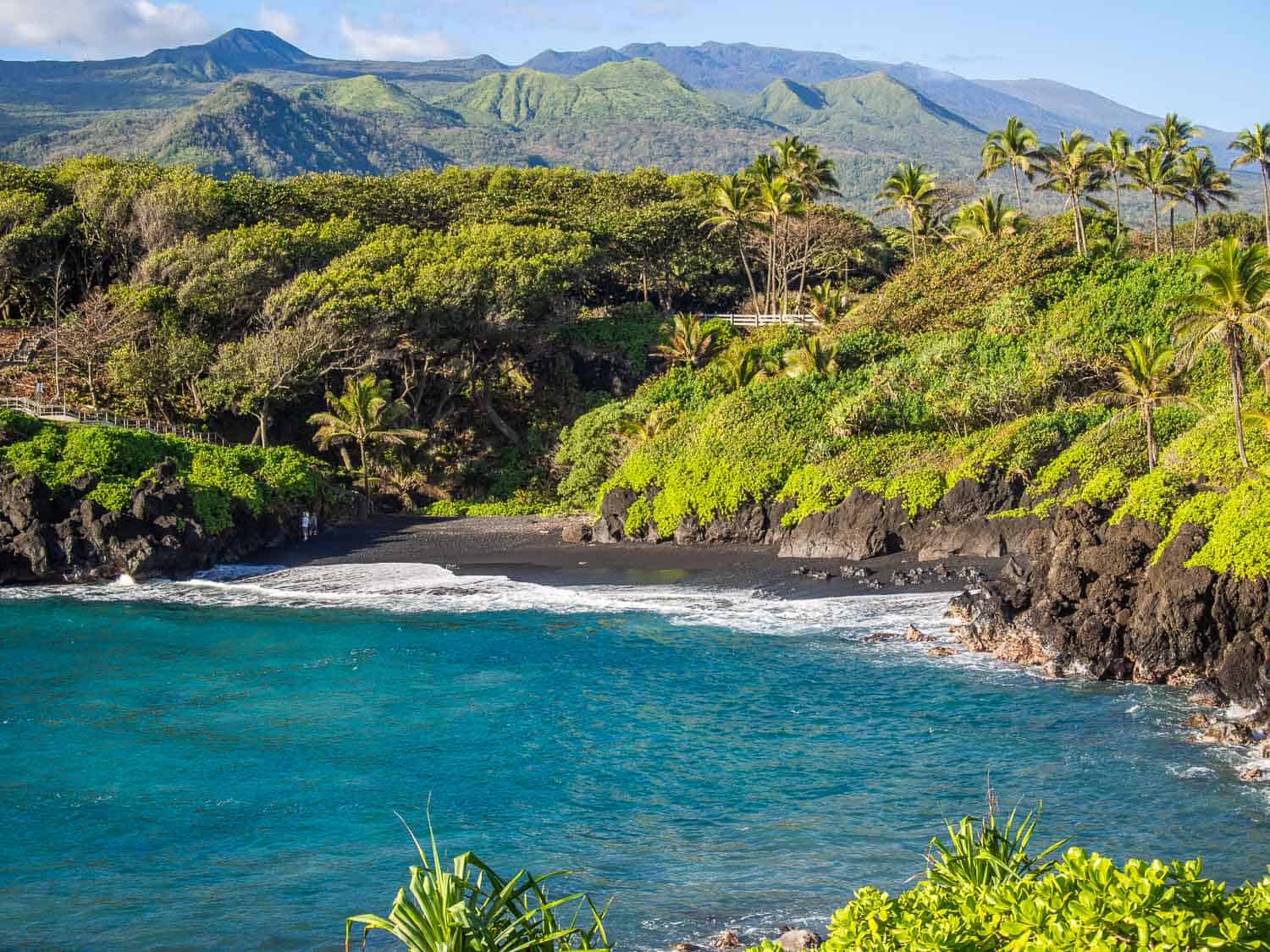 The black sand beach at Waianapanapa State Park is a highlight of a Maui itinerary