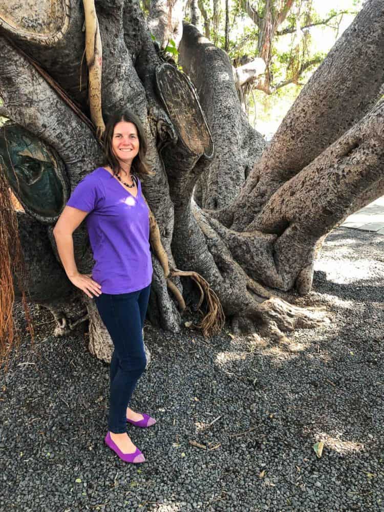 Erin wearing Rothys Point in mulberry by a banyan tree in Maui