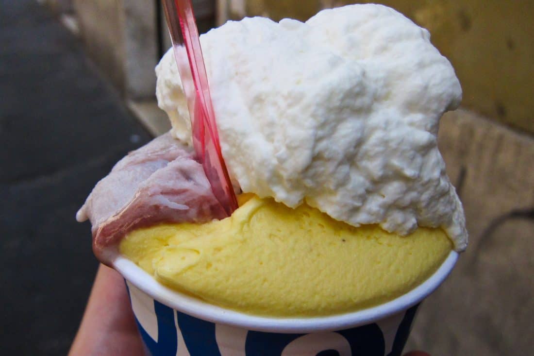 Crema and cherry gelato topped with panna (cream) at Giolitti in Testaccio, Rome