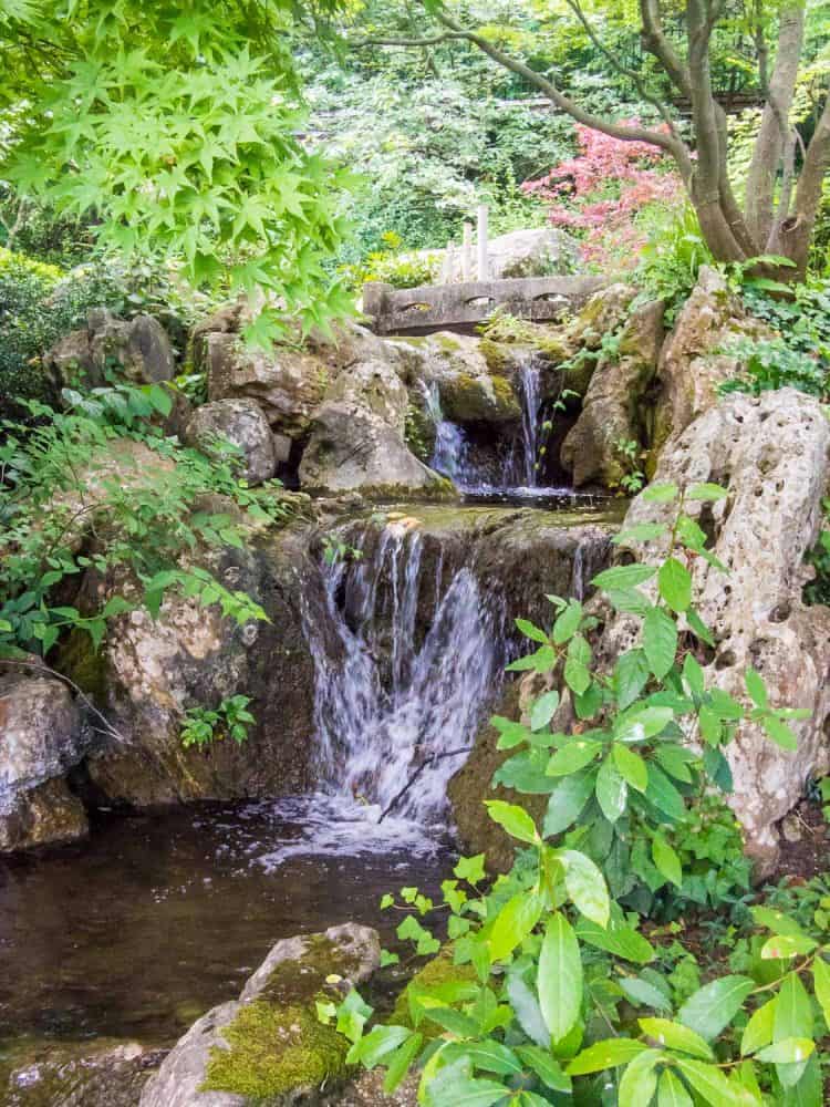 Waterfall in the Japanese garden in Orto Botanico gardens in Trastevere, Rome, Italy