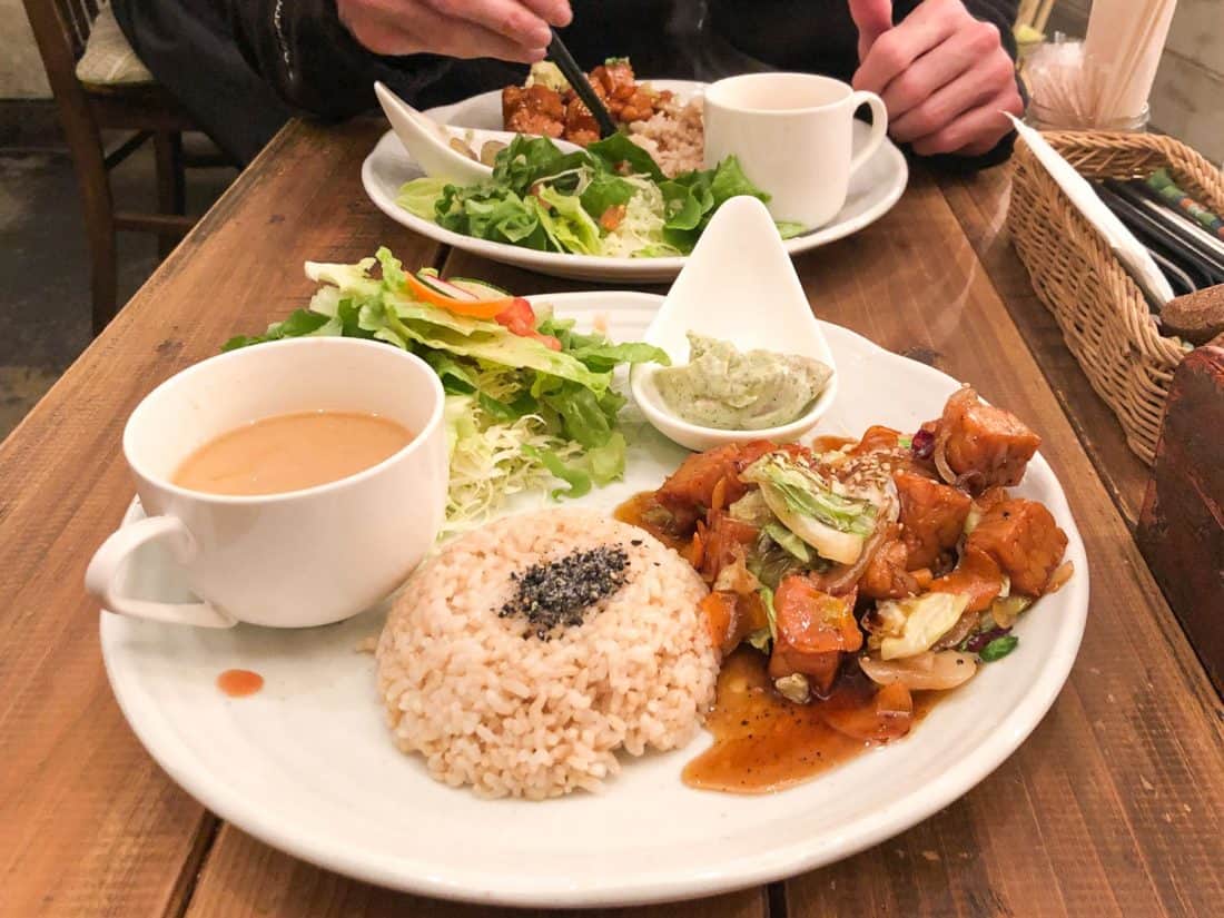 Lunch set with vegetable and tempeh teriyaki stir fry at Paprika vegan restaurant in Osaka, Japan