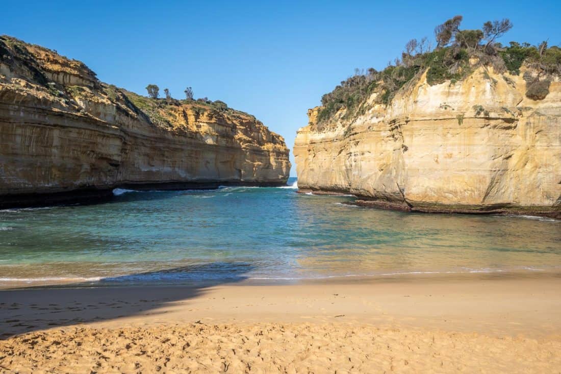 White cliffs and clear waters at Loch Ard Gorge beach, Great Ocean Road, Victoria, Australia