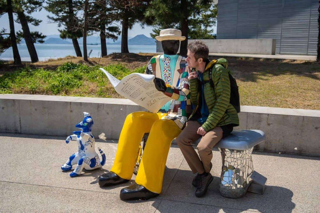 Sculpture of man reading newspaper on Naoshima Island, Japan
