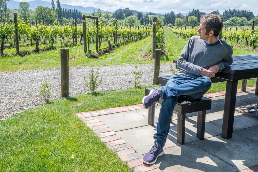 Simon wearing his lighter Allbird Tree Runners at a Nelson vineyard in New Zealand