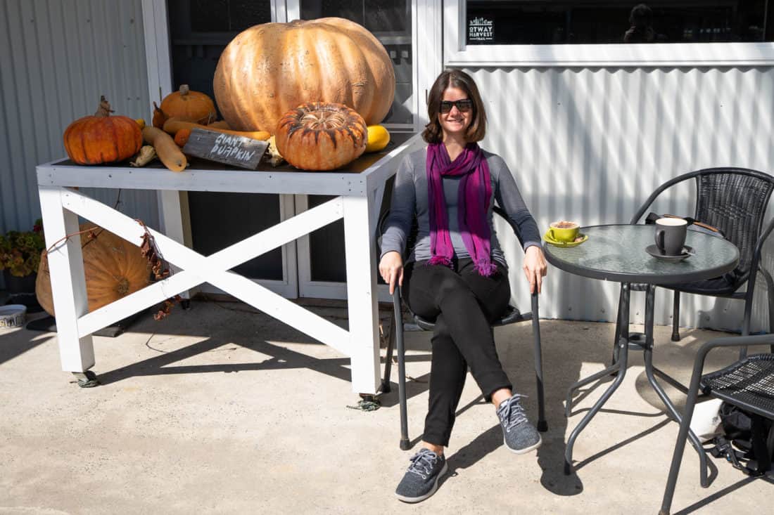 Wearing Allbirds wool runners in a cafe next to a giant pumpkin