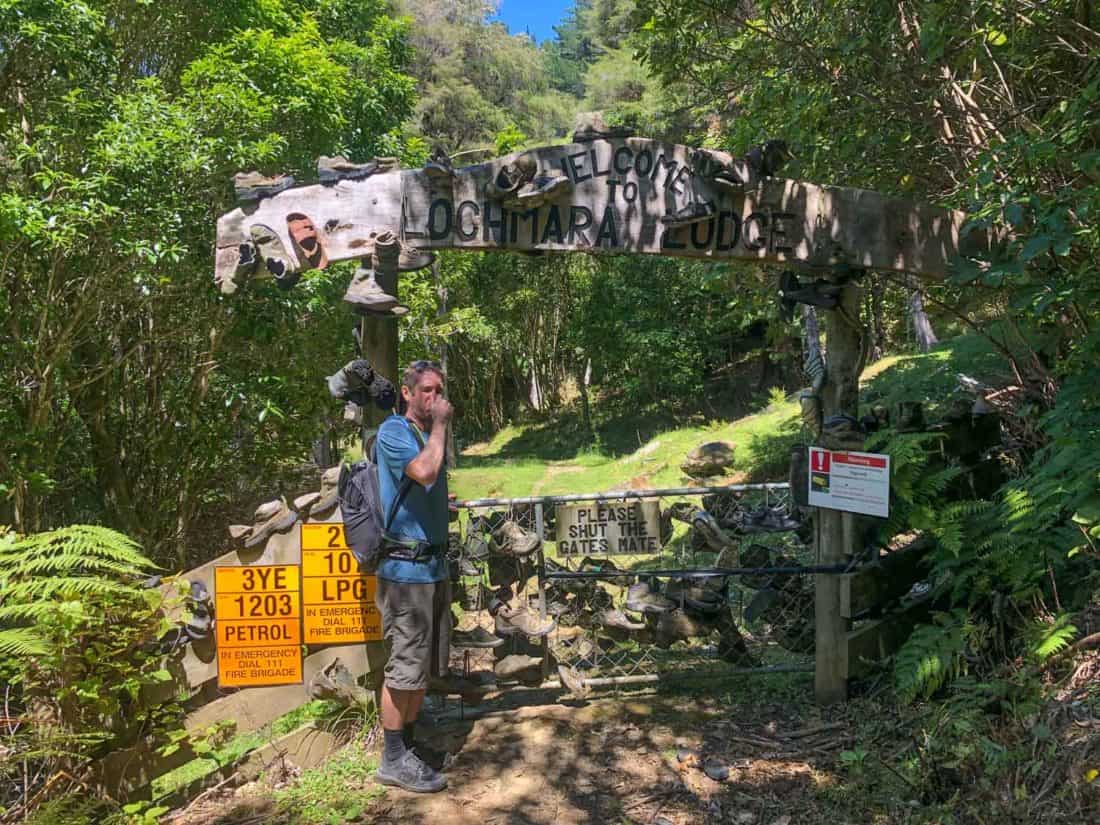 A gate covered in old boots at the entrance to Lochmara Lodge in the Marlborough Sounds