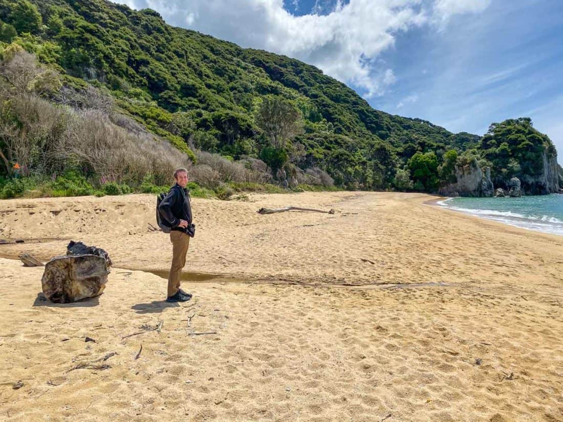 Walking on the beach at Anapai Bay on an Abel Tasman day trip, New Zealand