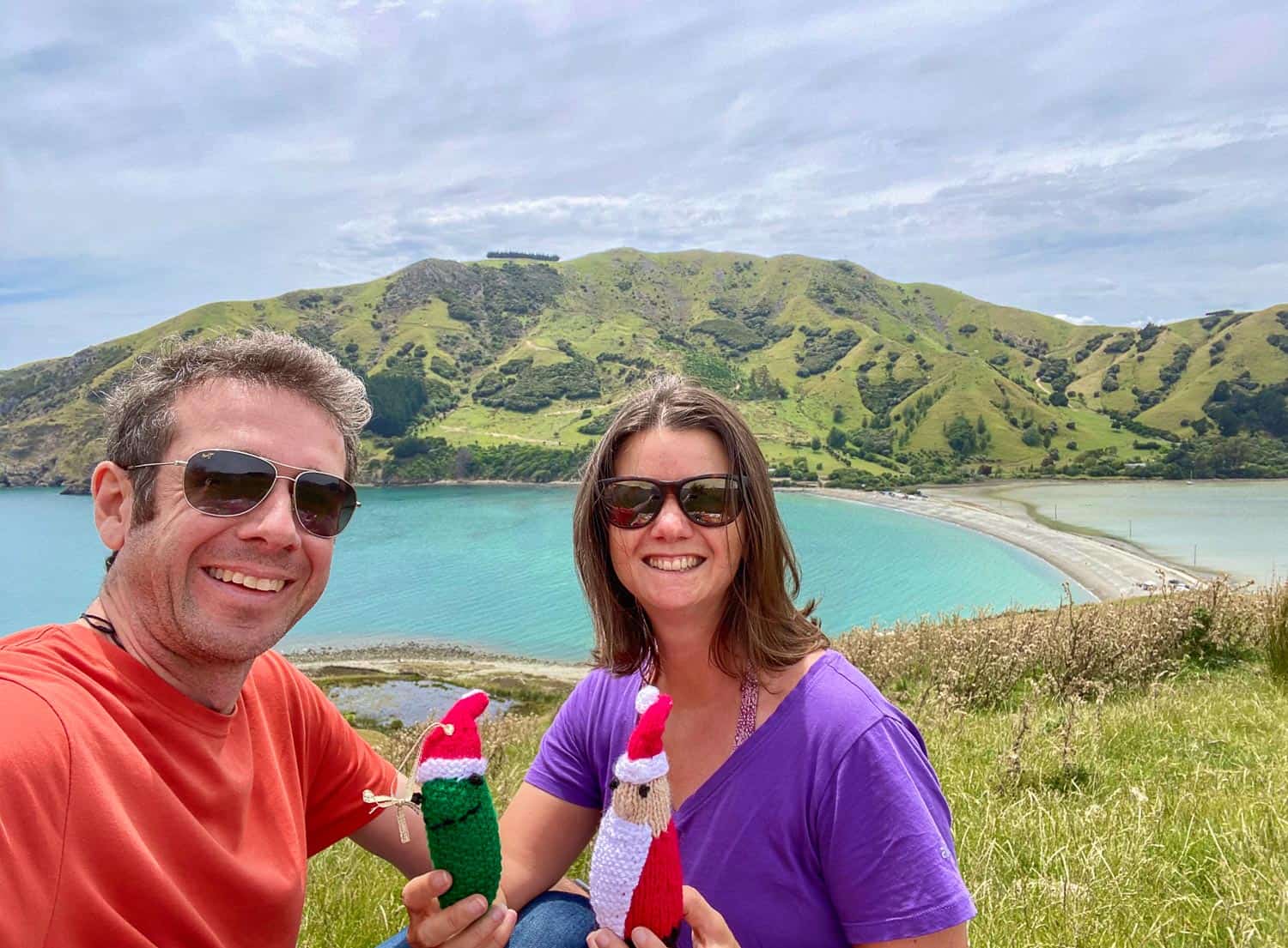 Simon and Erin with Christmas decorations on the hill above Cable Bay, New Zealand