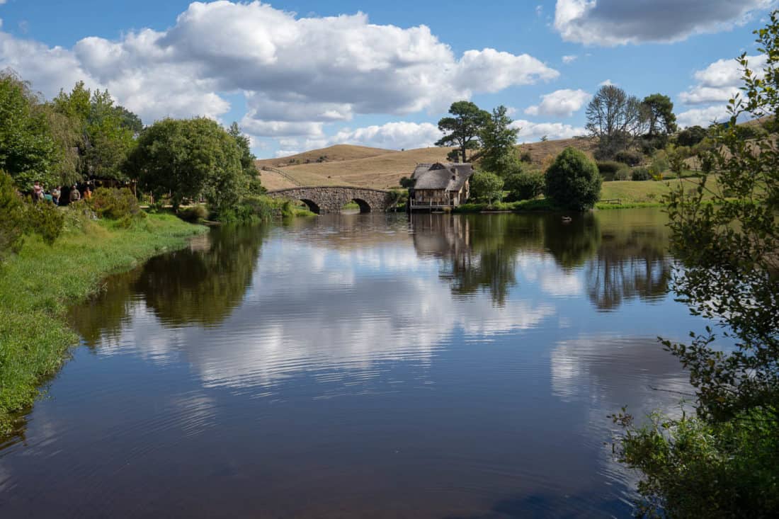 Lake and stone bridge at Hobbiton movie set, New Zealand