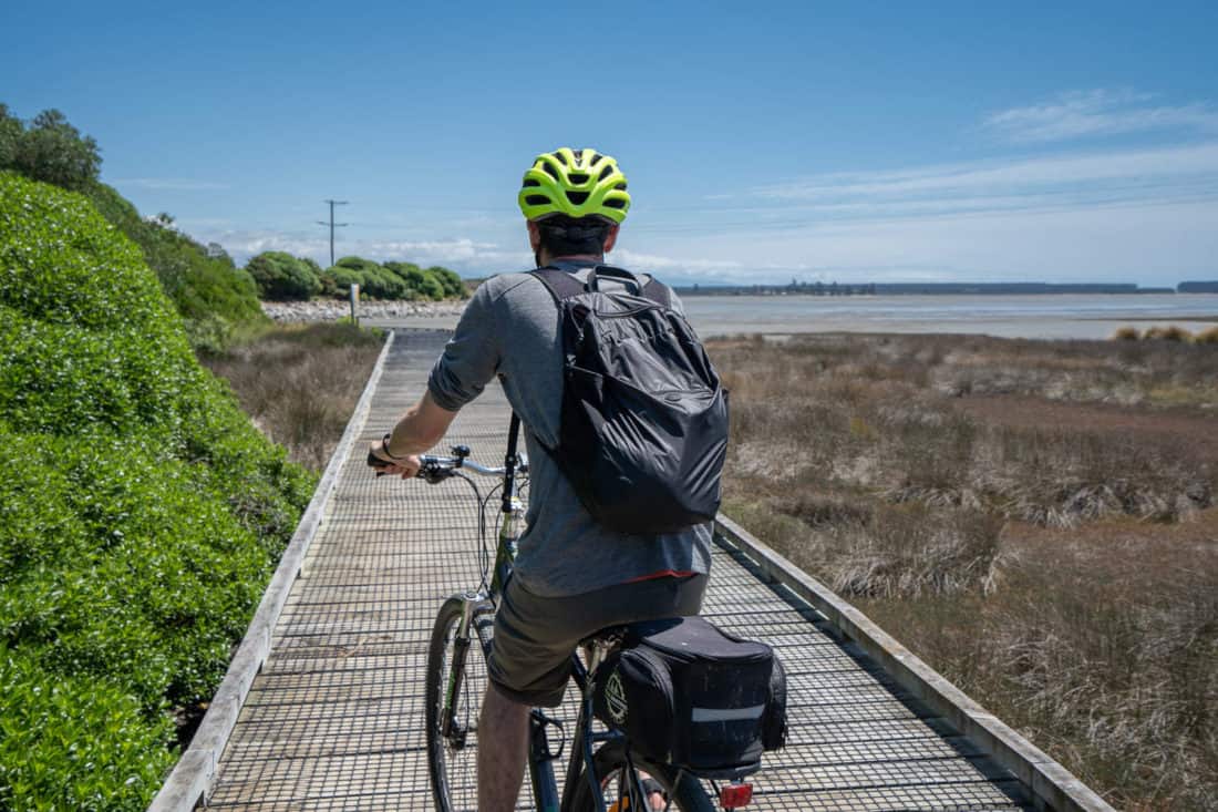 Cycling on the boardwalks on the Great Taste Trail from Nelson to Mapua, New Zealand