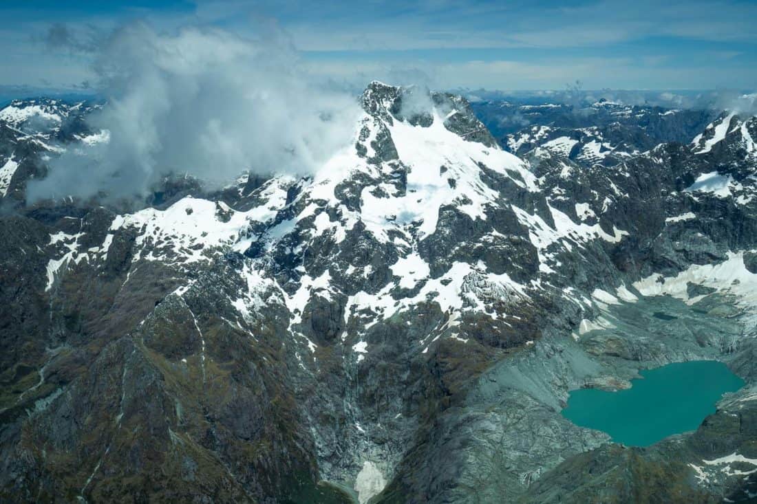 Glacial lake in the mountains on flight from Milford Sound to Queenstown