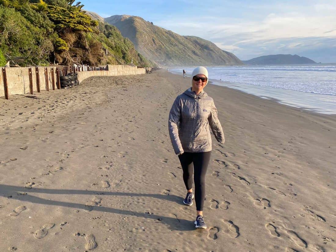 Erin walking on the beach in Allbirds Dashers