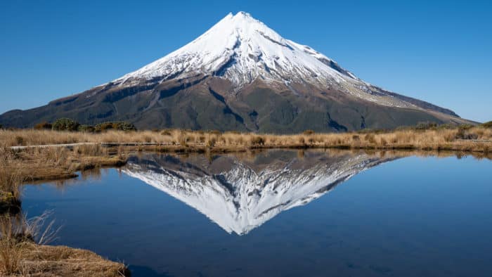 Reflection of Mount Taranaki in Pouakai Tarn, one of the best things to do in Taranaki New Zealand