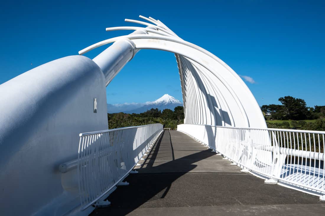 Mount Taranaki framed in the Te Rewa Rewa Bridge on the New Plymouth Coastal Walkway, New Zealand