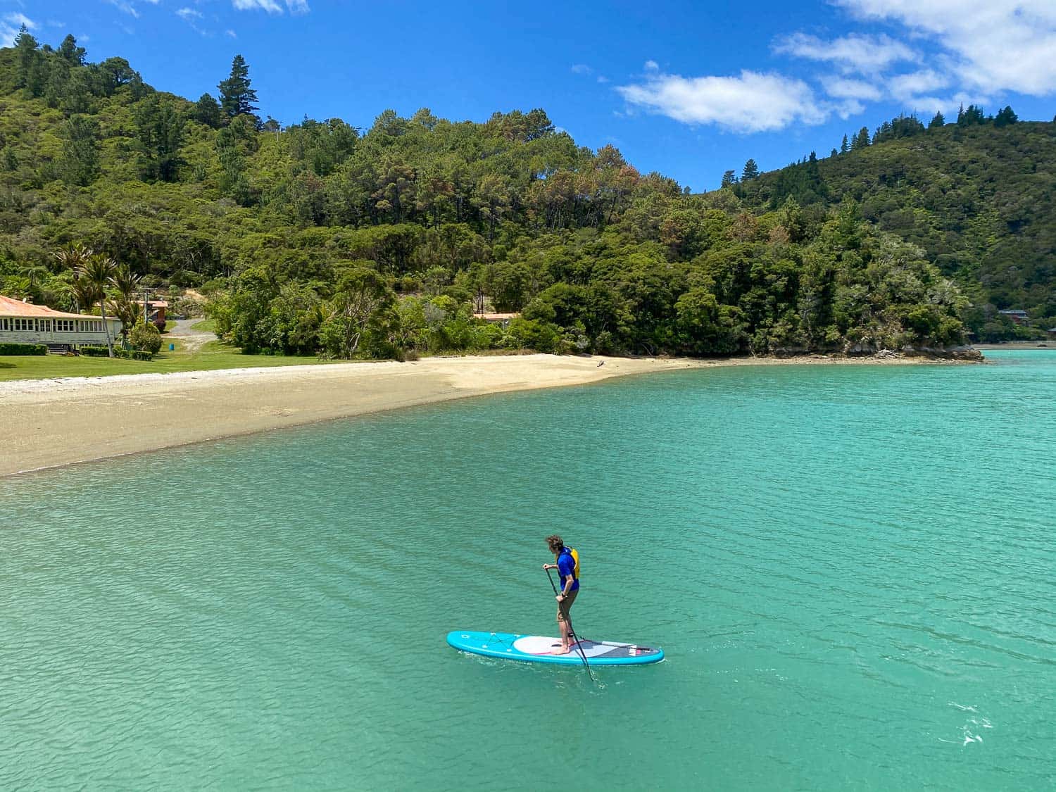 Simon standup paddleboarding at St Omer in the Marlborough Sounds