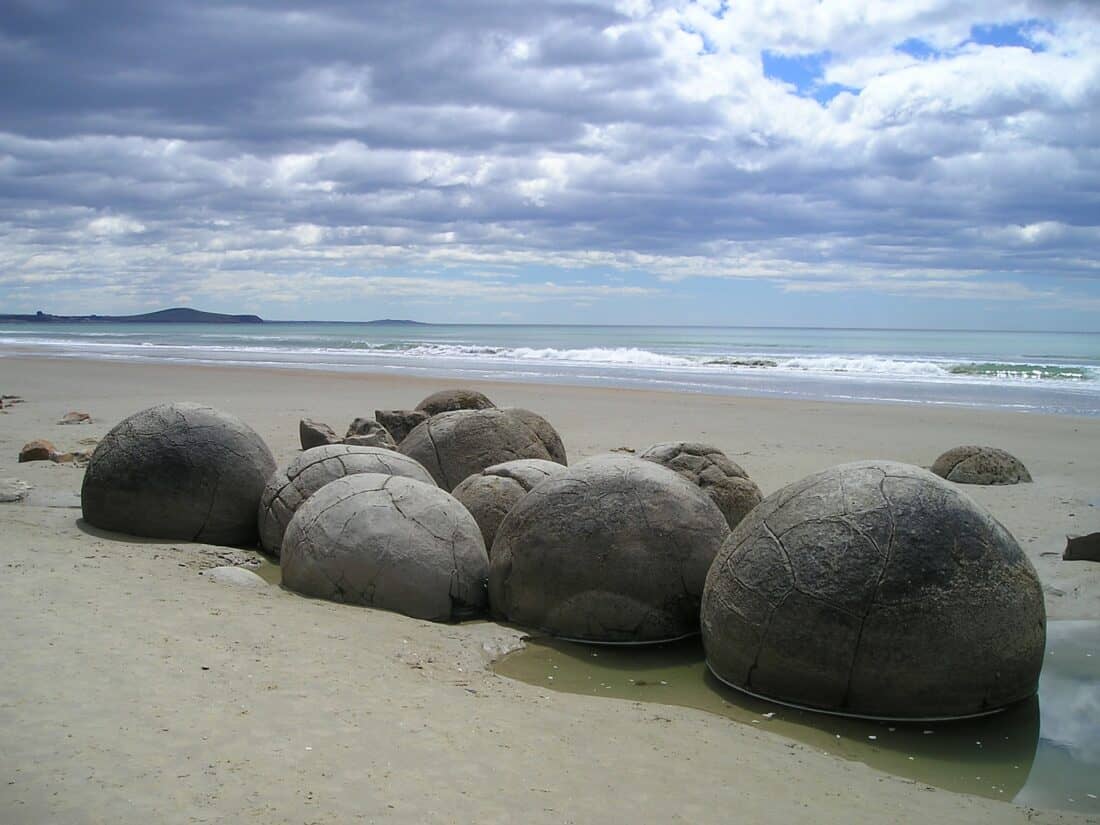 Moeraki Boulders Beach, one of the best road trip stops on the South Island East Coast in New Zealand