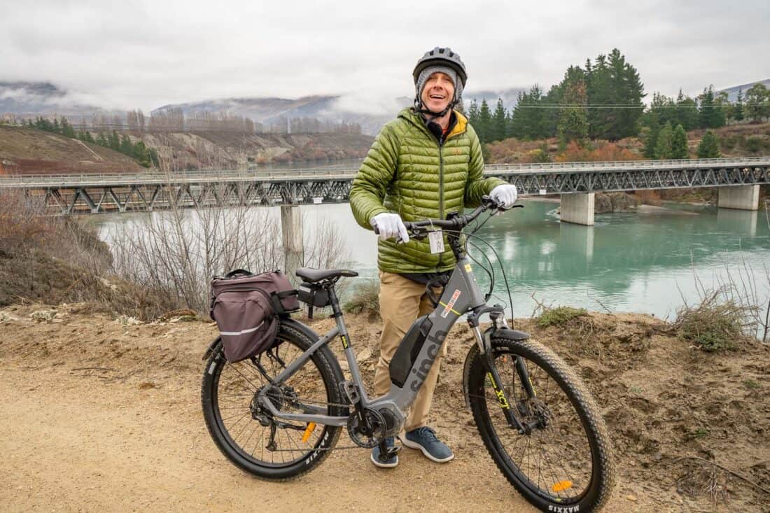 Simon and e-bike at Bannockburn Bridge on the Lake Dunstan Cycle Trail, New Zealand