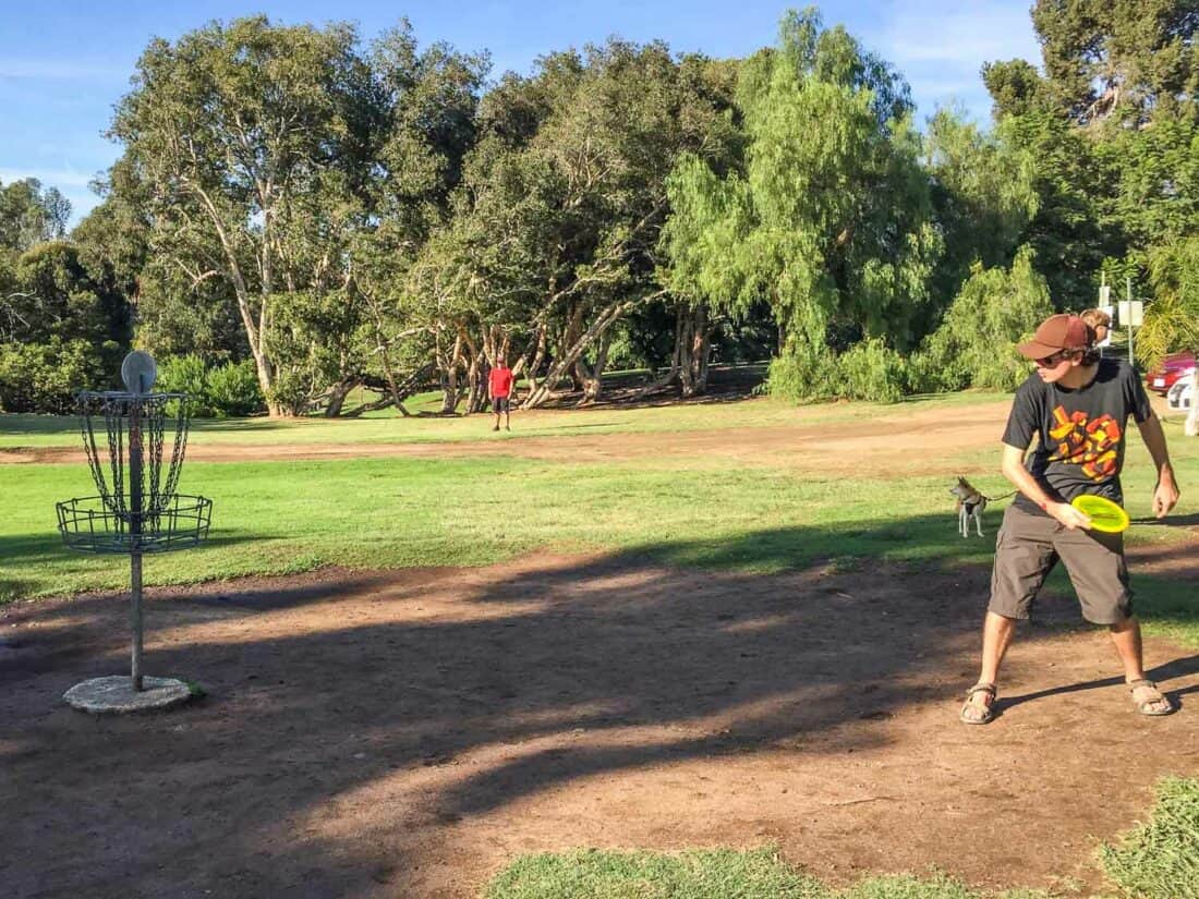 Simon playing disc golf at Morley Field in San Diego
