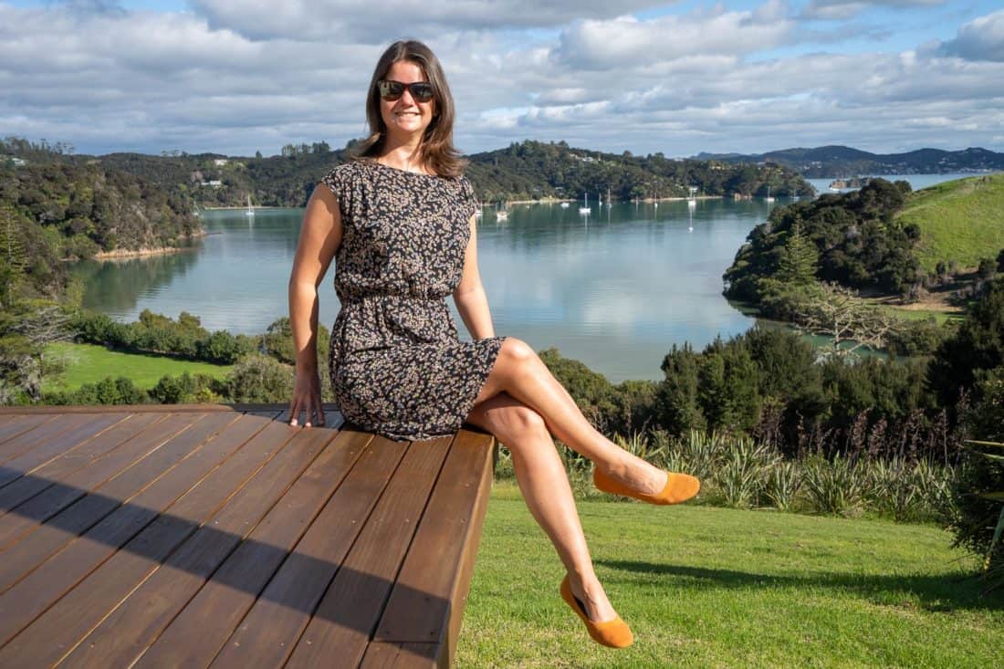 Erin wearing Allbirds Tree Breezers in Poppy on deck in Bay of Islands, New Zealand