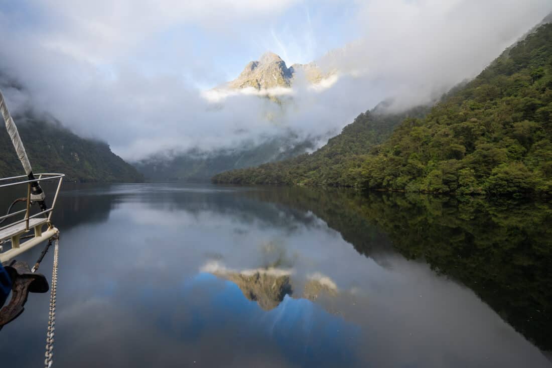 Misty early morning reflections on an overnight cruise in Doubtful Sound
