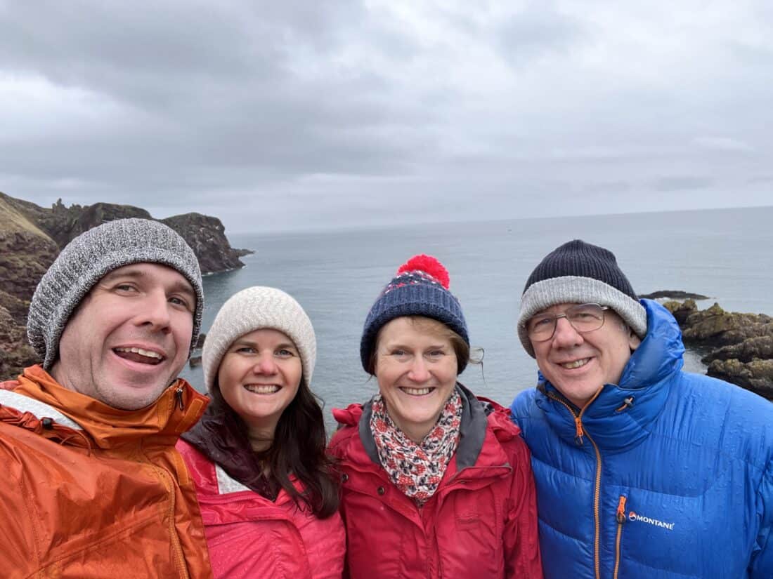 Me, Erin, my step-mum, and my Dad at St Abbs, the rugged Scottish coastlne and North Sea in the background.