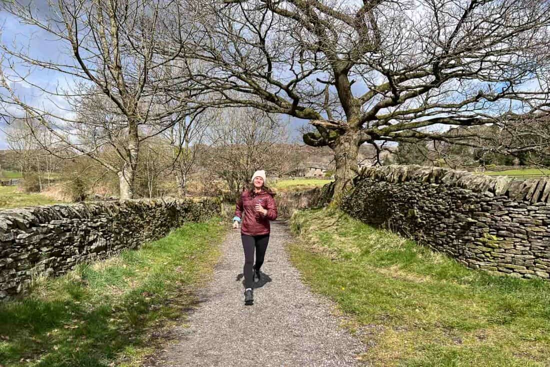 Running in the Allbirds Trail Runners SWT on a gravel path in the Peak District, England