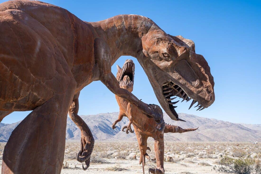 Carnotaurus and Allosaurus dinosaurs fighting sculpture in Borrego Springs