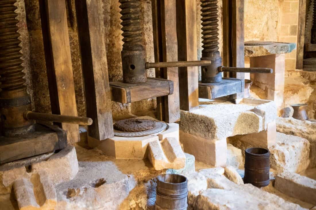 Wooden olive press at MOOM olive oil museum in Matera