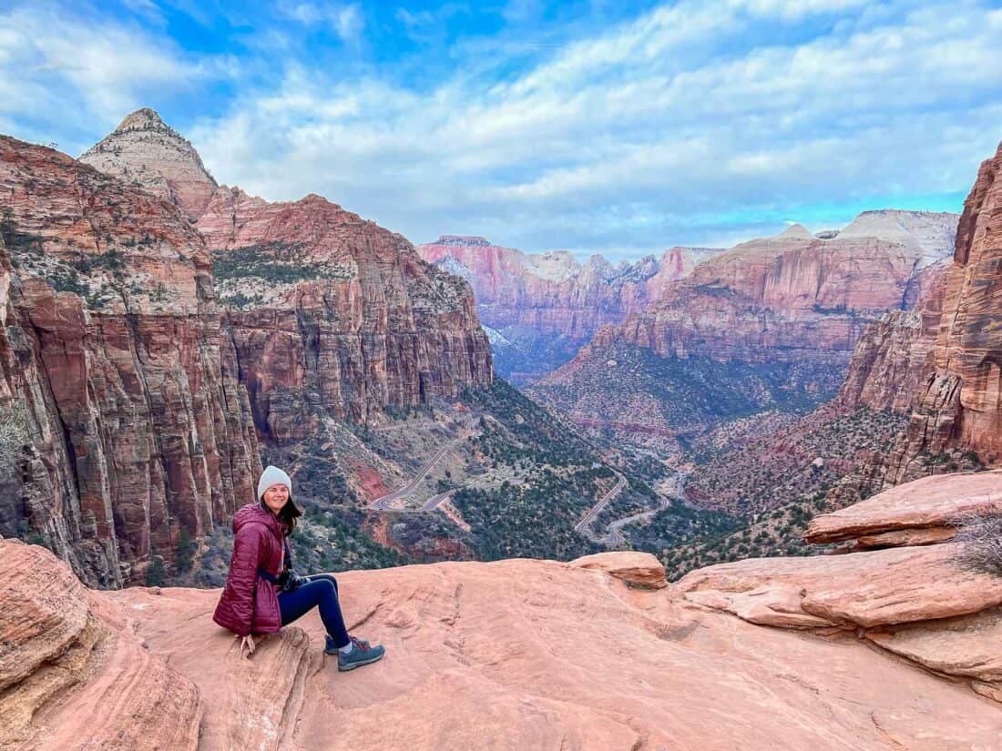 Erin in the winter clothes on her carry on packing list at Zion National Park