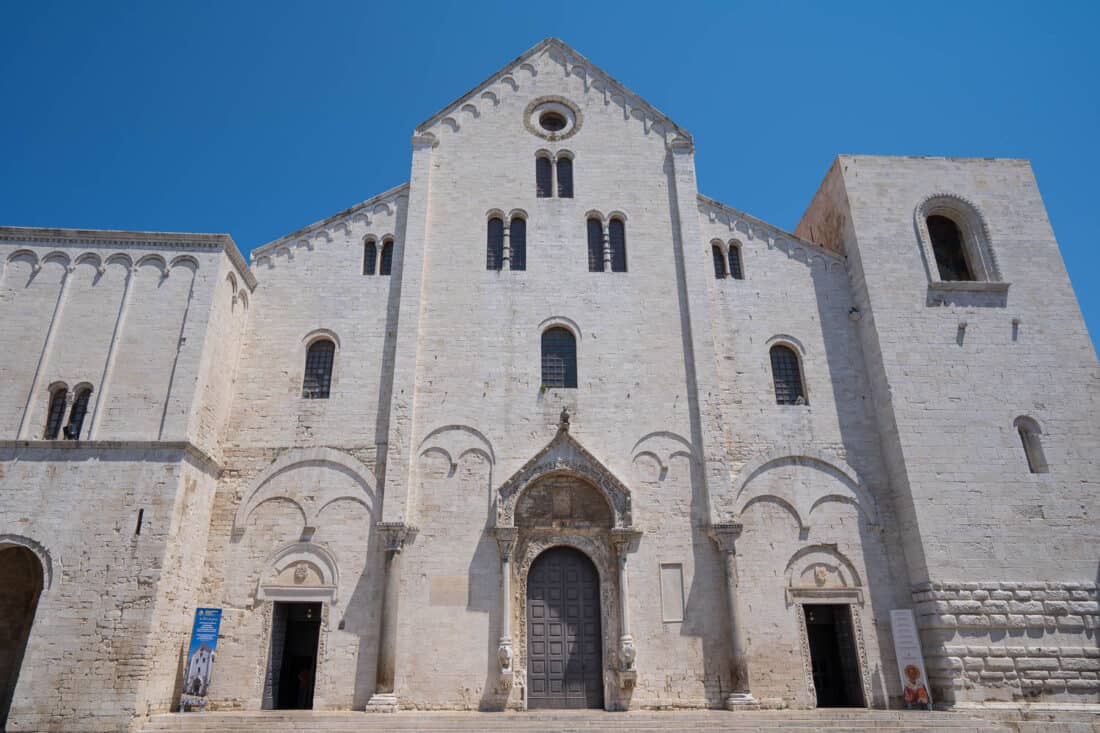 Facade of Basilica di San Nicola with a clear bright blue sky above, Bari, Italy