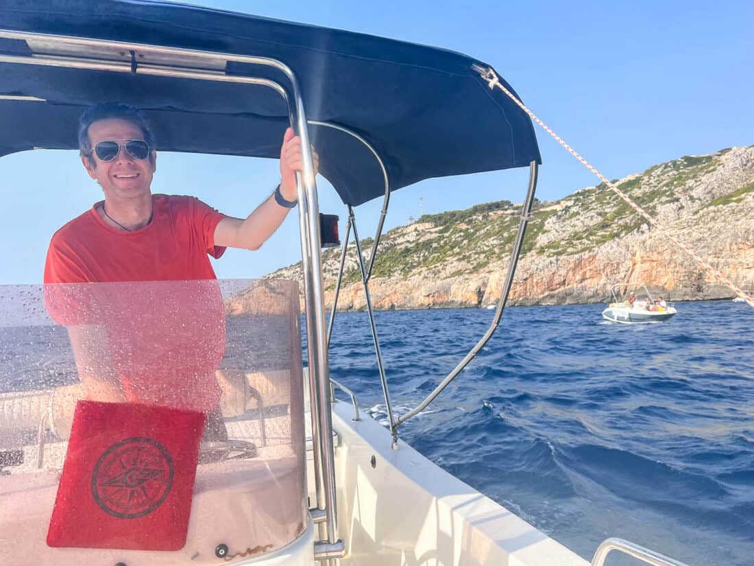 Simon on a boat in the waters around Leuca, Salento