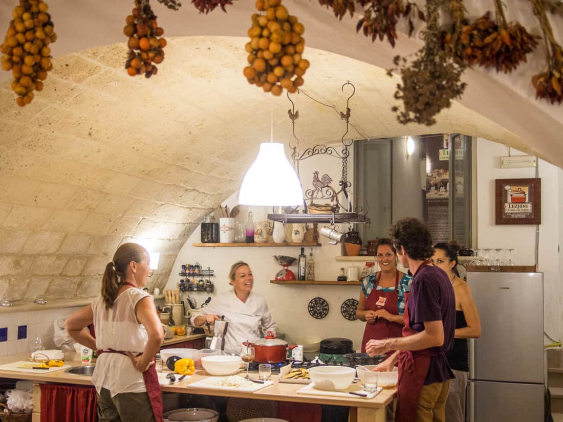 Cooking class in Lecce in a charming domed room with hanging dried fruit