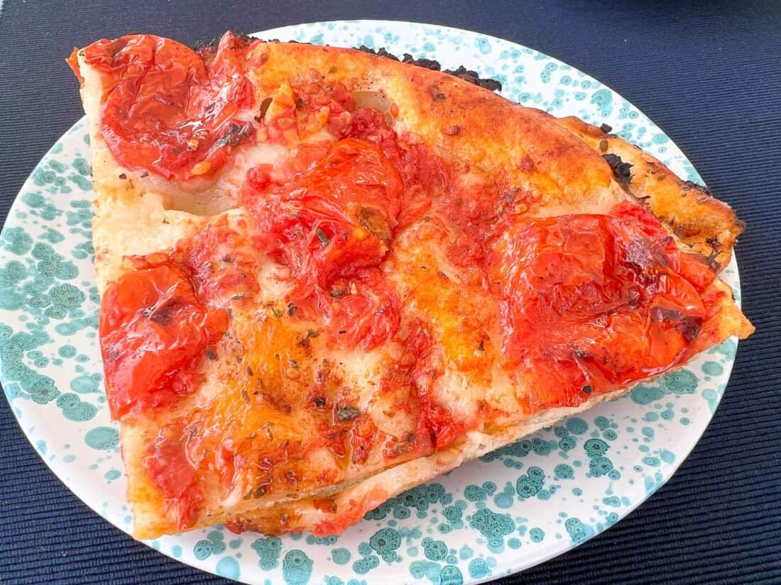 Freshly baked slice of tomatao and herb foccacia from Panificio Santa Rita, Bari