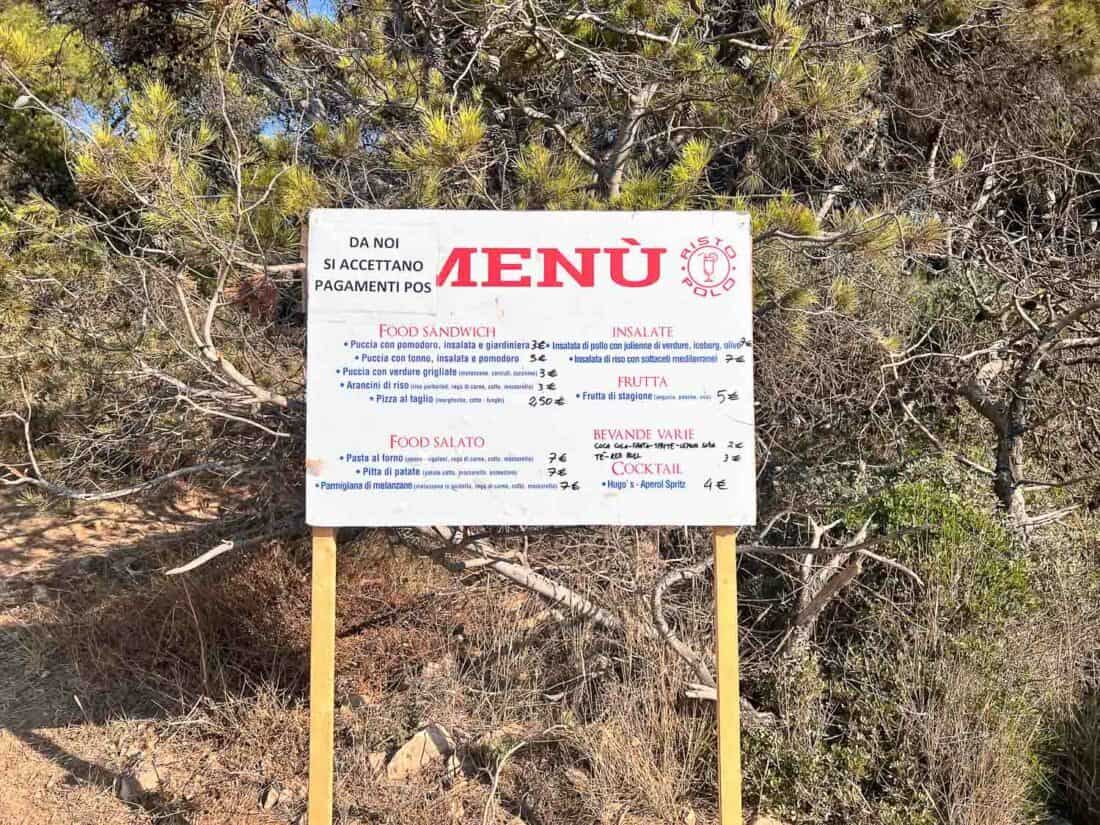 Snack stand menu at Porto Selvaggio beach, Italy