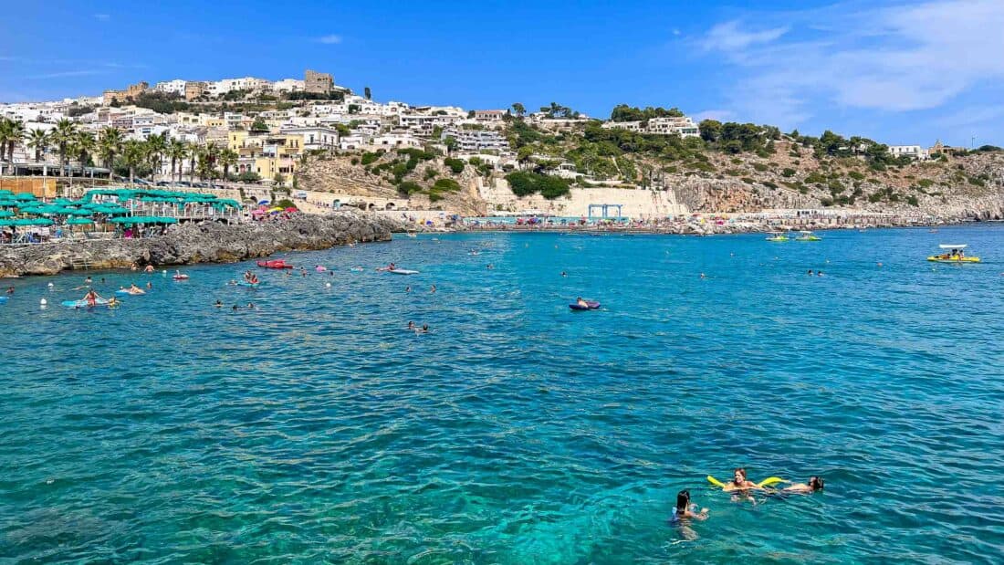 Swimmers in the bay at Castro Marina in Puglia, Italy.