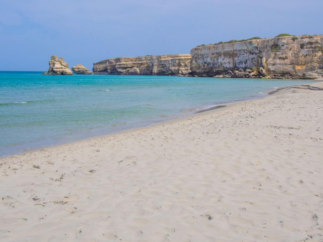 White cliffs, soft sandy beach and clear blue waters at Torre dell’Orso, Salento, Puglia, Italy