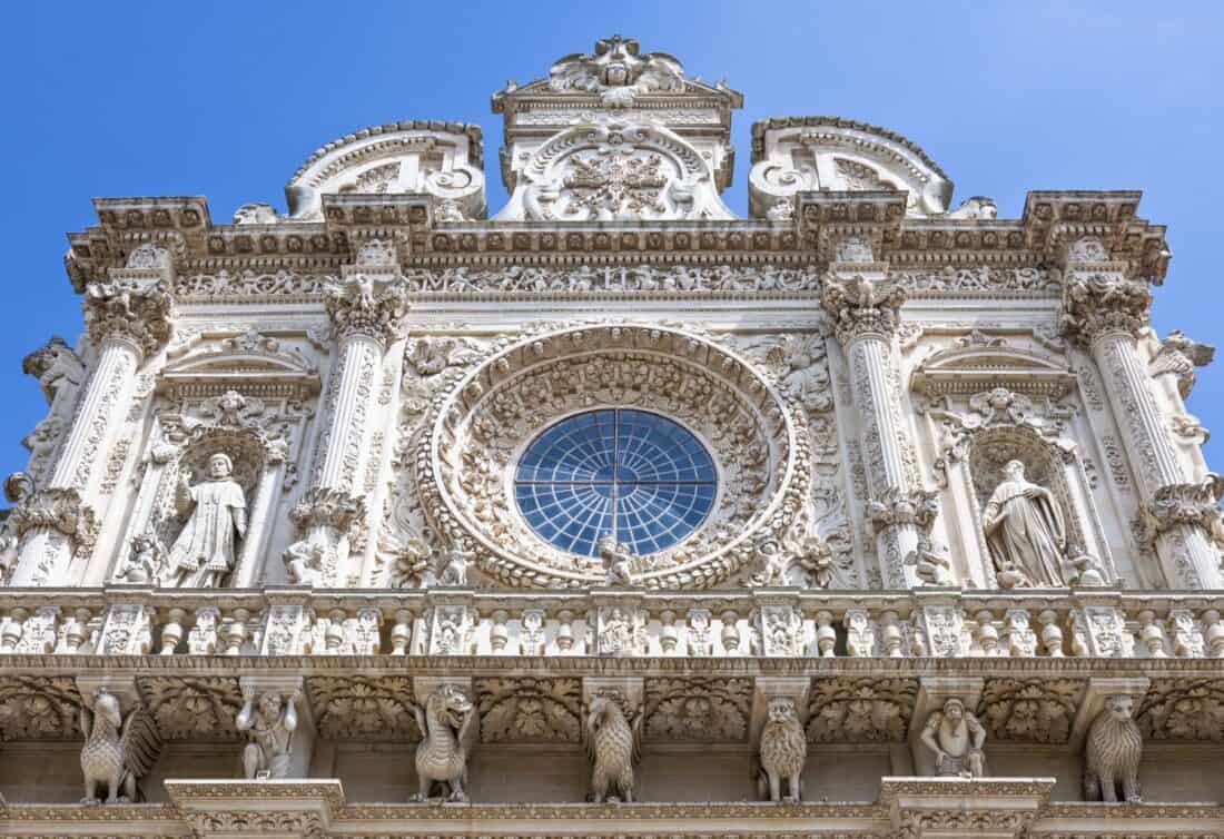 The carved baroque facade of Basilica di Santa Croce in Lecce, Puglia, Italy