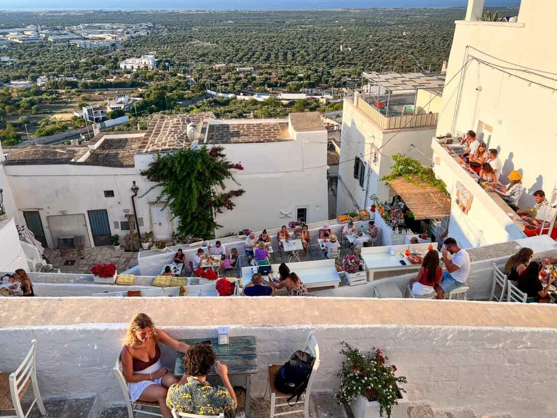 View of olive trees and sea from Borgo Antico Bistro in Ostuni, Italy