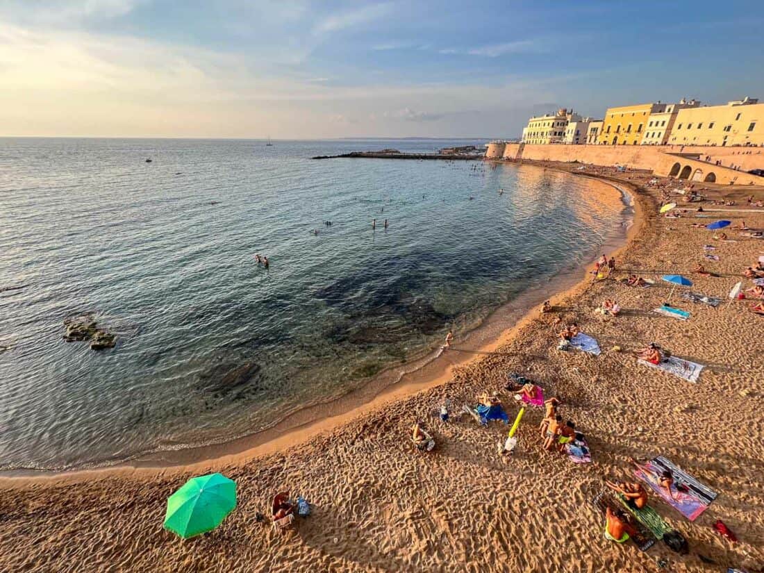 Sunset glow at the city beach in Gallipoli, Puglia, Italy