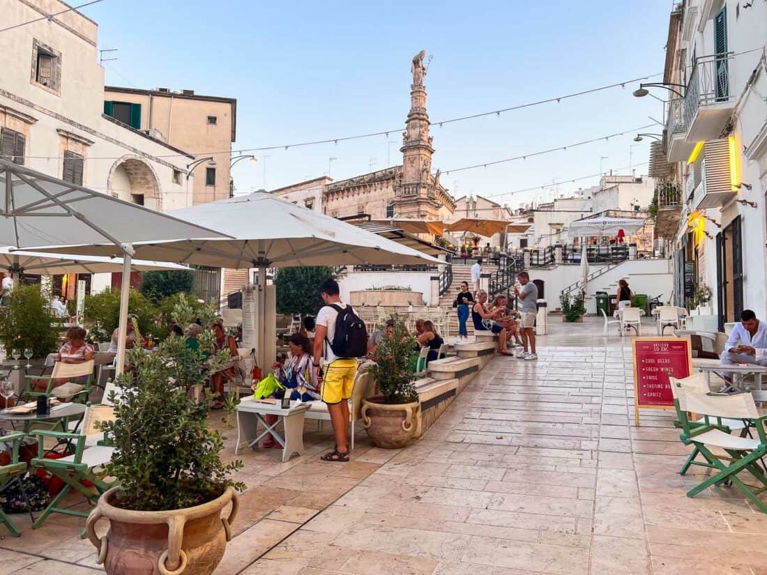 Outdoor cafes in Via Vito Tamborrino in Ostuni Italy