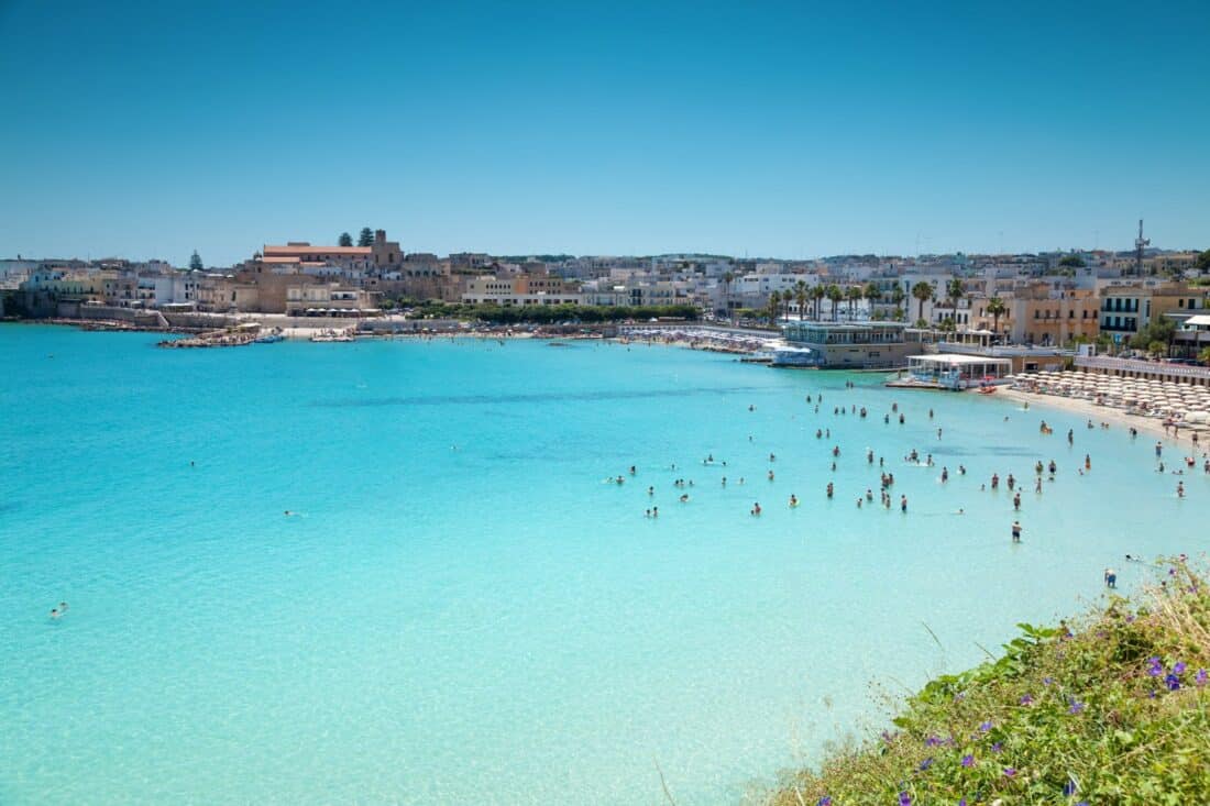 Cliffside view of aquamarine waters and beaches in Otranto