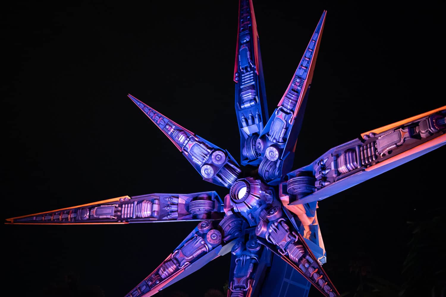 The Star Blaster illuminated at night outside the Guardians of the Galaxy ride at Epcot, Disney World Florida