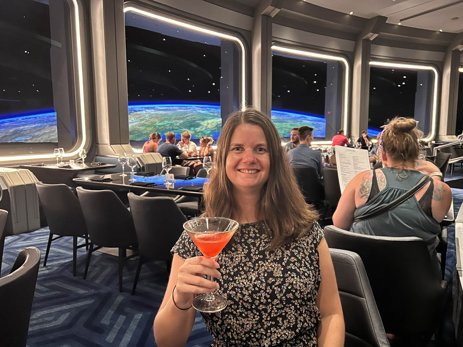 Erin with a cocktail at Space 220, Epcot, Disney World