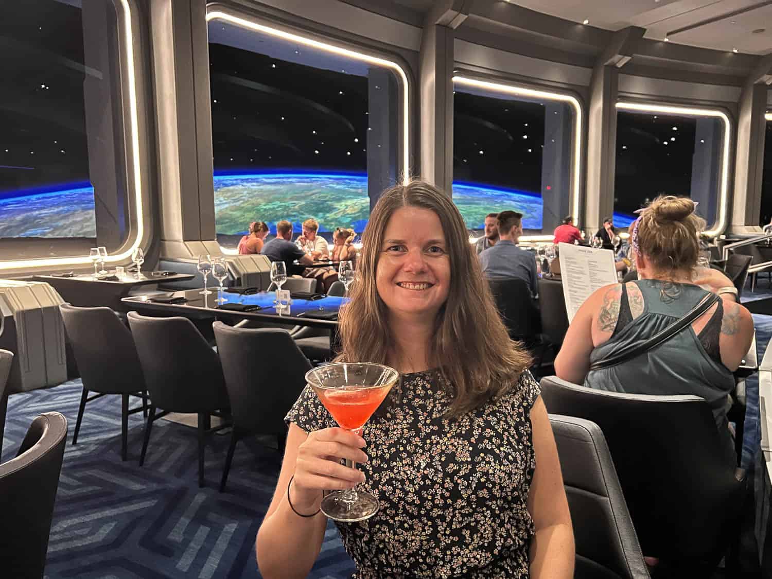 Erin with a cocktail at Space 220, Epcot, Disney World