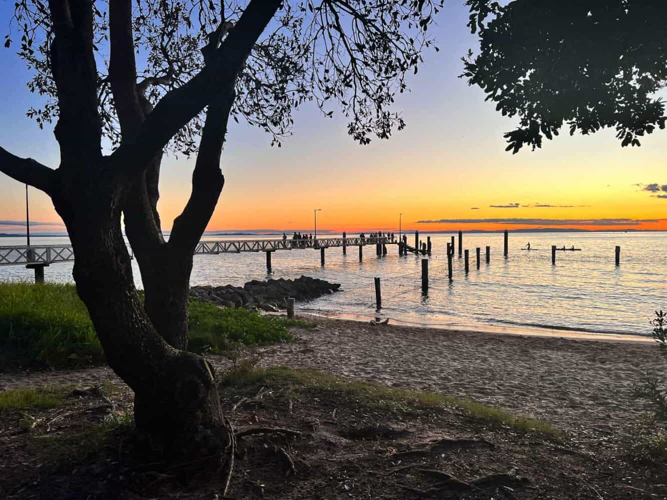 Sunset at Amity Point with silhouette of the jetty, North Stradbroke Island, Queensland, Australia