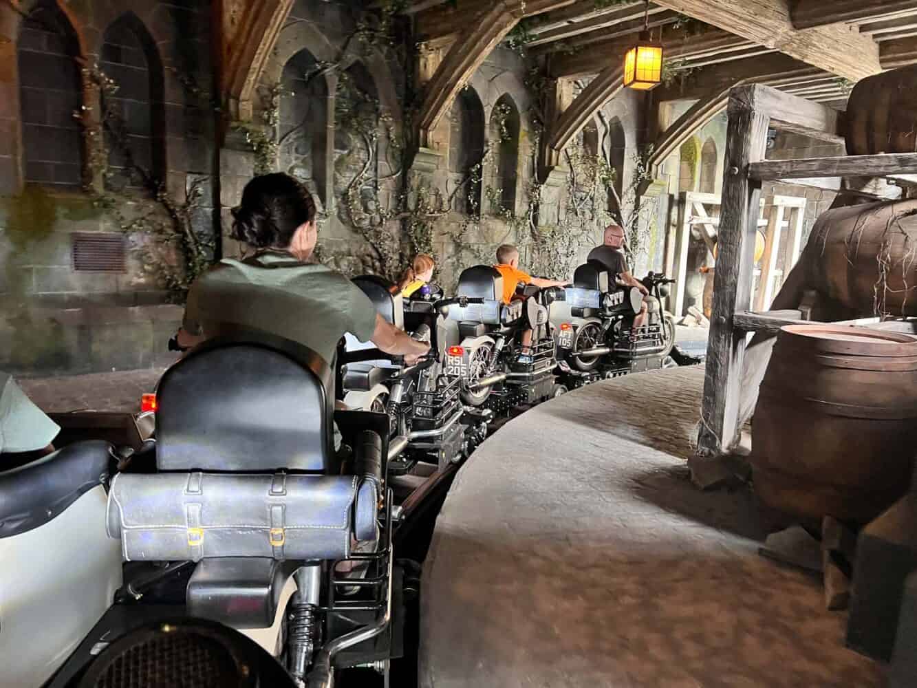 People riding motorbikes on Hagrid's Magical Creatures Motorbike Adventure, Universal Orlando, Florida, USA
