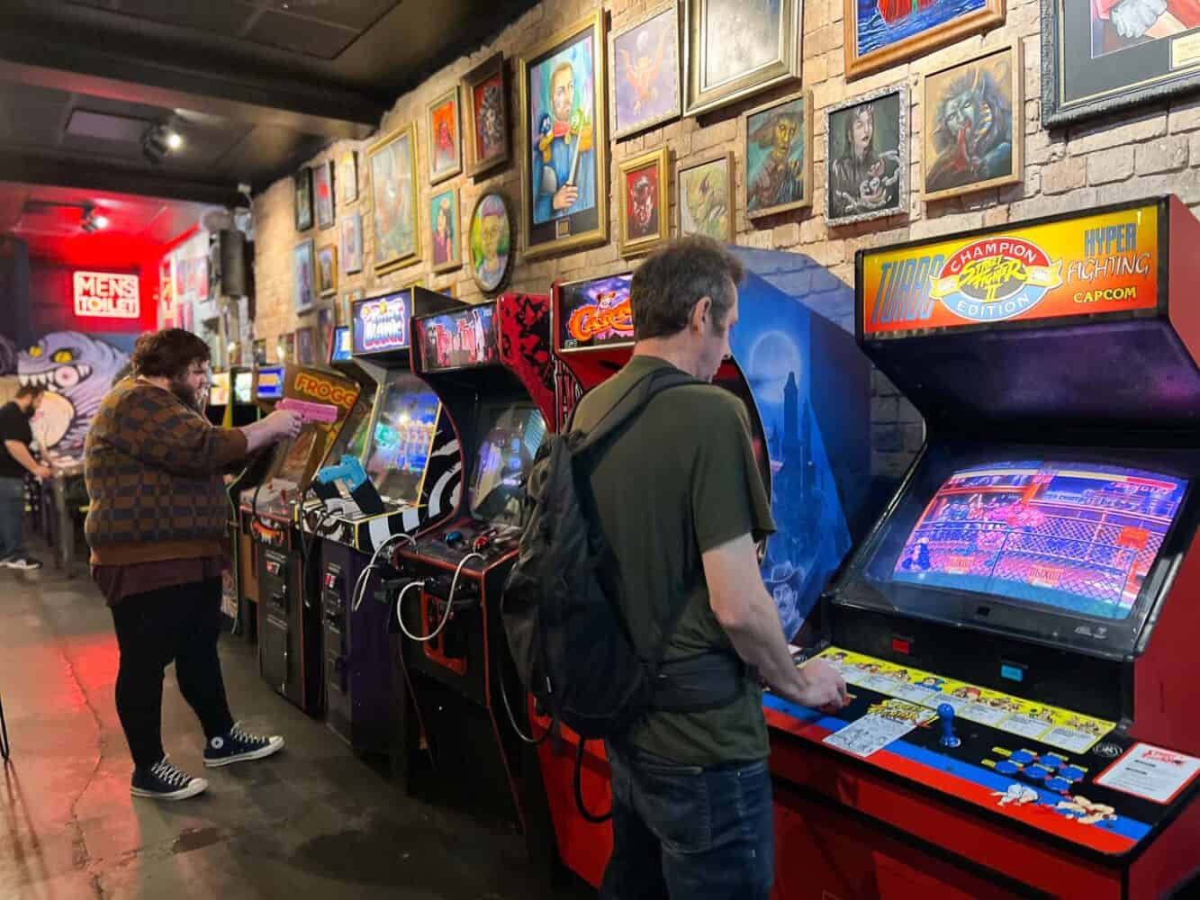 Simon playing on vintage arcade games at Netherworld Arcade Bar, Brisbane, Australia