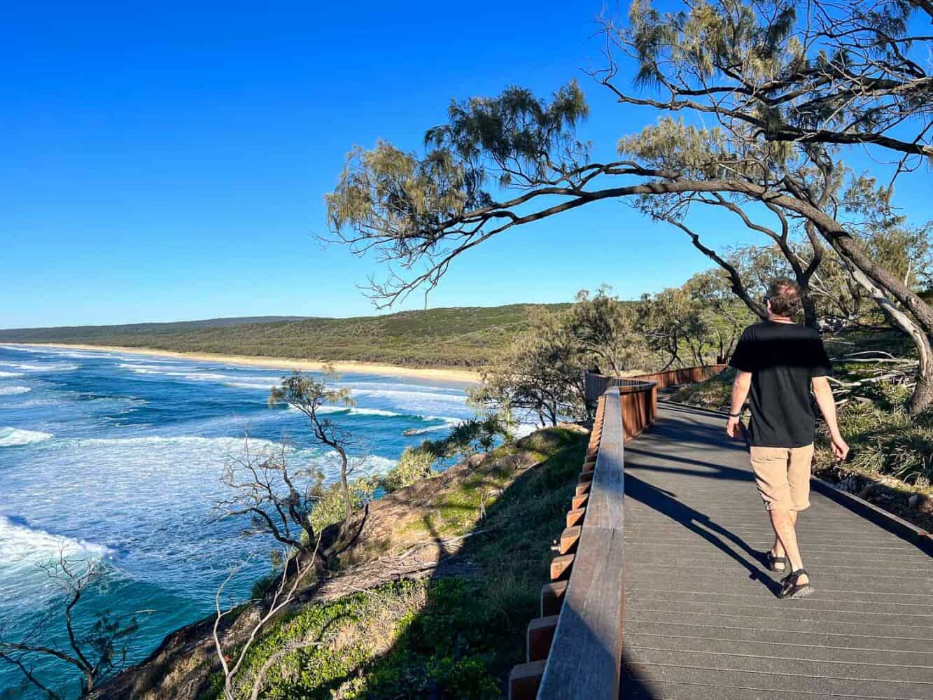 Simon walking along the boardwalk on the North Gorge Walk at Point Lookout, North Stradbroke Island, Queensland, Australia