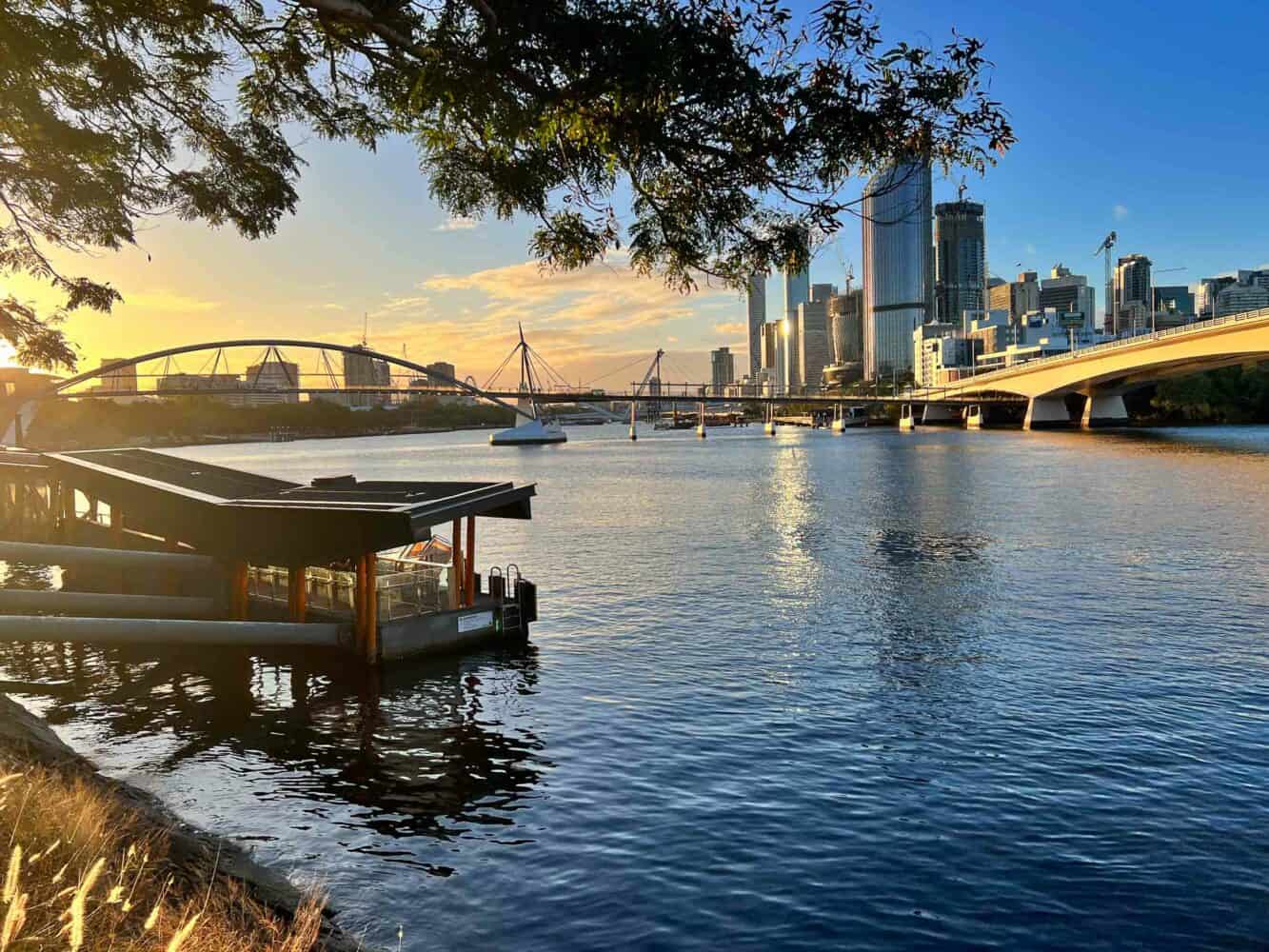 Sunset river view on The Cliffs boardwalk on a weekend in Brisbane, Queensland